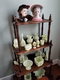 whatnot shelf with Fenton glass and vintage head vases