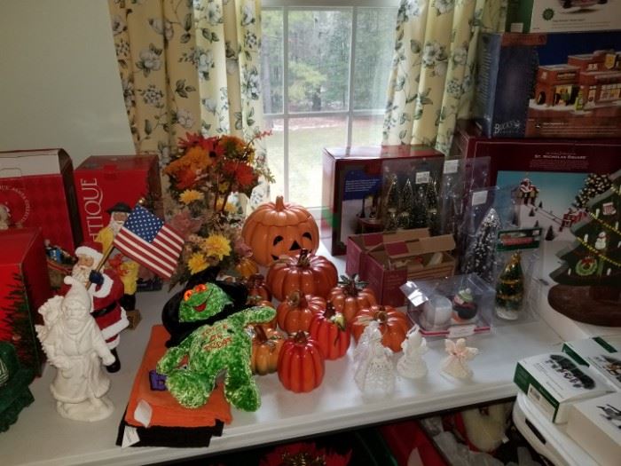 holiday decorations including pumpkins and Department 56 houses 