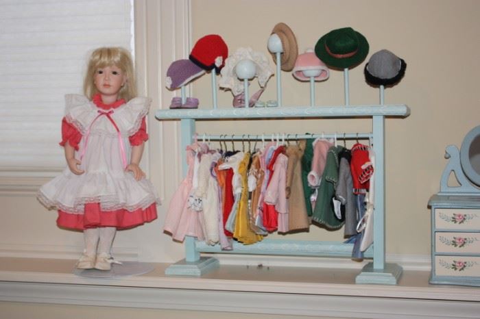 Many of the doll clothes are hand smocked