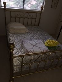One of two brass beds