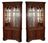 Pair of mahogany corner cabinets with beveled glass