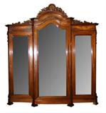 Mahogany triple armoire with carved crown