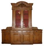 Monumental bookcase with Bacchus head focal