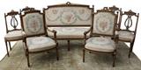 7 piece Louis XVI parlor set in petite needlepoint upholstery.