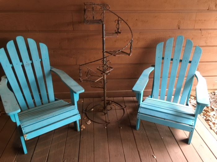 Pair of Adirondack-style arm chairs in blue paint; antique wrought iron tiered plant stand