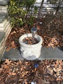 Concrete planter, one of many, as well as fountains, birdbaths and other outdoor decor