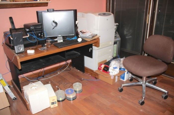 Desk and Desk Chair with Office Equipment and Supplies