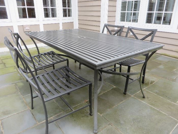 Restoration Hardware rectangular dining table with six chairs (two armchairs and six side chairs) with iron finish. Table is from the Carmel line, handcrafted of rustproof aluminum
