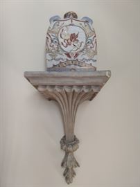 One of a pair of wall sconces and porcelain Asian jugs.