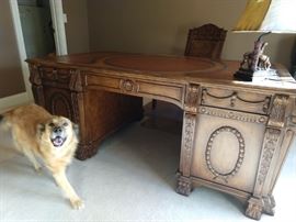 Hooker Furniture partners desk, 20th c., from the Seven Seas Collection, desk top with gilt accented leather inserts, each side having central keyboard drawer with drop front flanked by two cabinets, one cabinet with two shelves, the other cabinet with a large drawer, sides accented with carved scrolls and swags, rising on stylized claw feet, approx. 34"h, 72"l, 42"w. Meet Bella - she's a real sweetie!