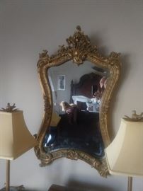 Vintage French gold gilt beveled glass wall mirror.