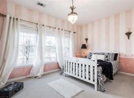 Formerly the little girls room, now a guest room, as she's graduated to a more sophisticated environment. This bed is a convertible, meaning that it converts from a crib, to a daybed, to a double bed, as the child ages - MAGIC!! This "Crib 4 Life" thing was purchased at Polka Tots, in 2002, for $1,300.00. Yep, I have the receipt!