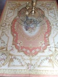 French Aubusson rug, with glass/wrought iron coffee table.