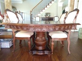 Side and base detail of the Bernhardt mahogany dining table.