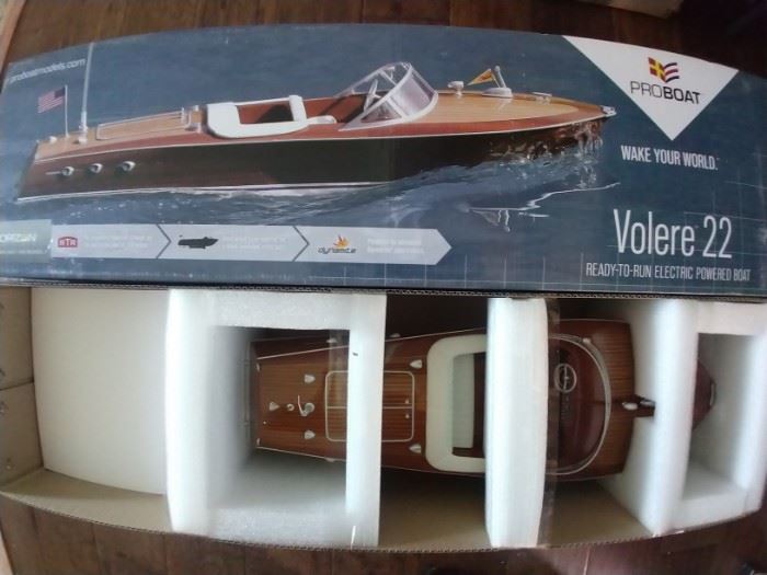 SO - here's something you don't see at the average estate sale. That's because we don't DO average! NIB Proboat Volere 22 RC 1950's Chris Craft mahogany runabout boat - very cool!