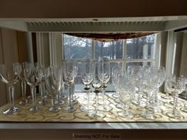 Waterford stemware on the left, wheel-cut vintage crystal stemware on the right.