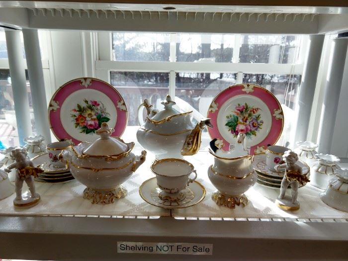 Old Paris porcelain tea set, with hand painted floral plates.