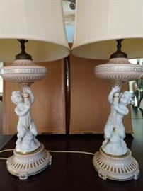 Vintage pair of porcelain RPM (Austria) table lamps, with original shades and finials.