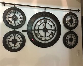 Unique clock tracks time in 5 time zones.  Several magnetic cities so you can choose who to keep track of!!