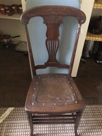 Antique chair with leather tooled seat