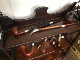 Another fine shelf with a collection of antique pipes 