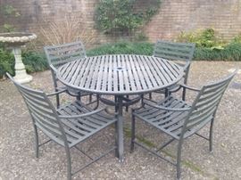 Patio table & chairs and the birdbath are for sale.