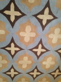 Blue, tan, and brown 8 feet x 10 feet rug