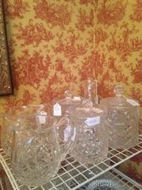 Pressed glass pitchers and biscuit barrels