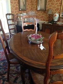 Dining table comfortably seats 6-8 ( has 2 leaves); chairs are sold separate from the table.