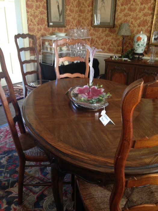 Dining table comfortably seats 6-8 ( has 2 leaves); chairs are sold separate from the table.