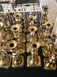 Many brass candle holders