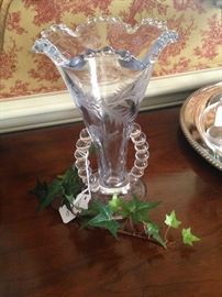 One of two candlewick vases