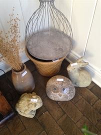 Stone frog, owl, and rabbit yard art