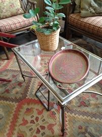 Metal coffee table with a glass top