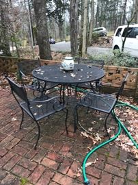 #68	Black Wrought Iron Table w/4 chairs  42"x29 round	 $100.00 
