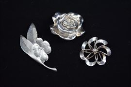 Sterling Floral Broach Trio https://ctbids.com/#!/description/share/101321