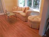 Custom sofa and tufted ottoman