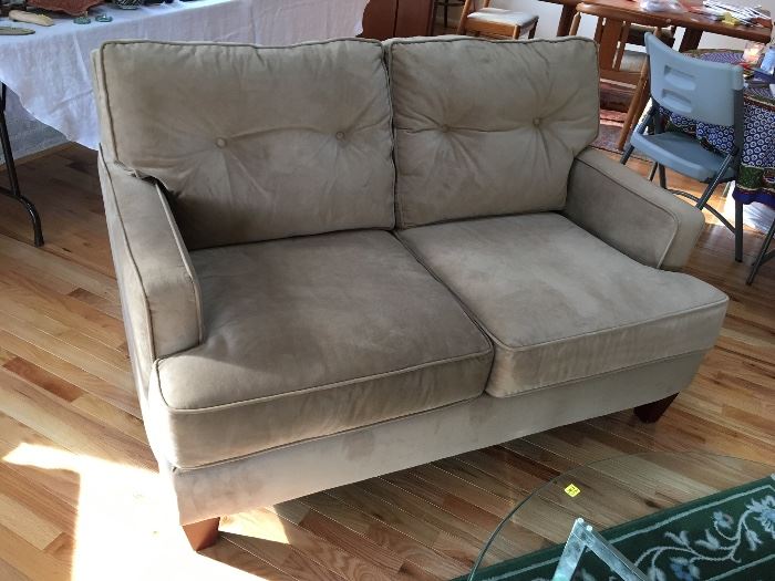 The perfect size Loveseat from Haverty's upholstered in tan suede fabric
