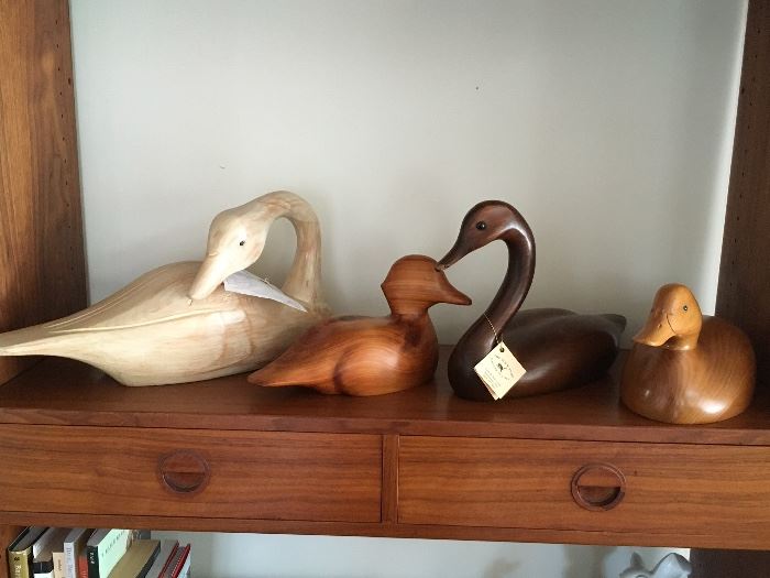Variety of Duck Decoys made from different types of carved wood.