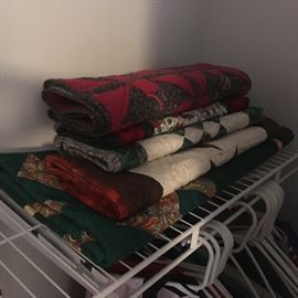 Assortment of small handmade Quilts