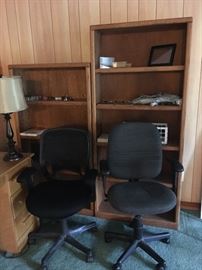 Pair of tall Oak Bookcases with a pair of black Office Chairs