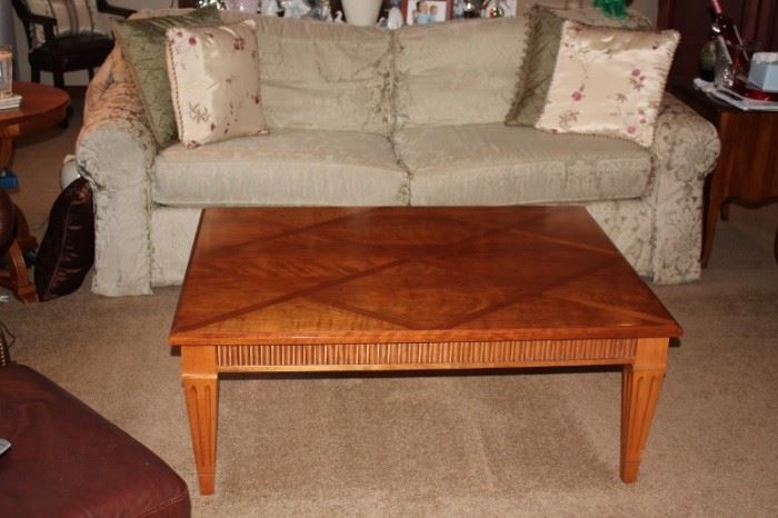 Wood Coffee Table with Attractive Accents and Sofa with Decorative Pillows