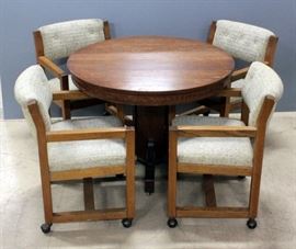 Round Oak Pedestal Table 29.5"H x 42"Dia And Four Rolling Chairs