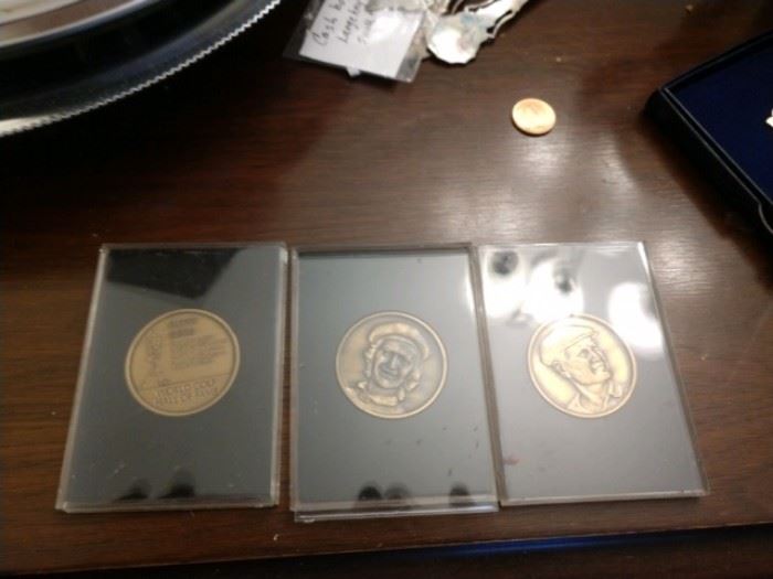 Three golf coins 