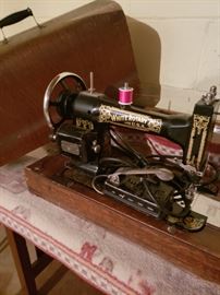 Antique White portable sewing machine in wood carrying case