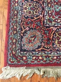 Detail of Persian rug under drop-lead table.