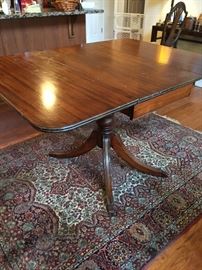 Mahogany drop-leaf table with silver drawer.