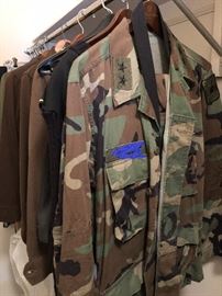 A CLOSET FULL OF MILITARY CLOTHING (NAME TAG ERASED FOR PHOTO ONLY)