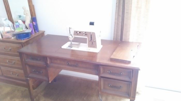 Singer sewing machine with cabinet. Front left leg is broken, $65