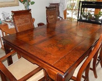 FABULOUS ASIAN STYLE THOMASVILLE DINING TABLE, WITH 2 EXTRA LEAVES UNDERNEATH(SLIDE OUT), 6 CHAIRS(INCLUDES 2 CHAIRS W/ARMS AND CUSTOM MADE TABLE TOPPER. VERY DETAILED TABLE TOP
